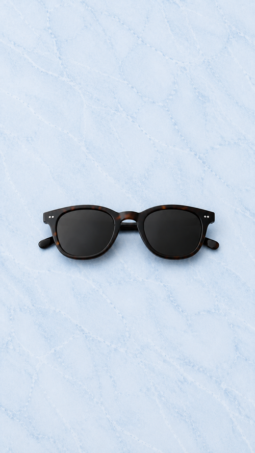 REUT Amalfi tortoise sunglasses on light blue marble